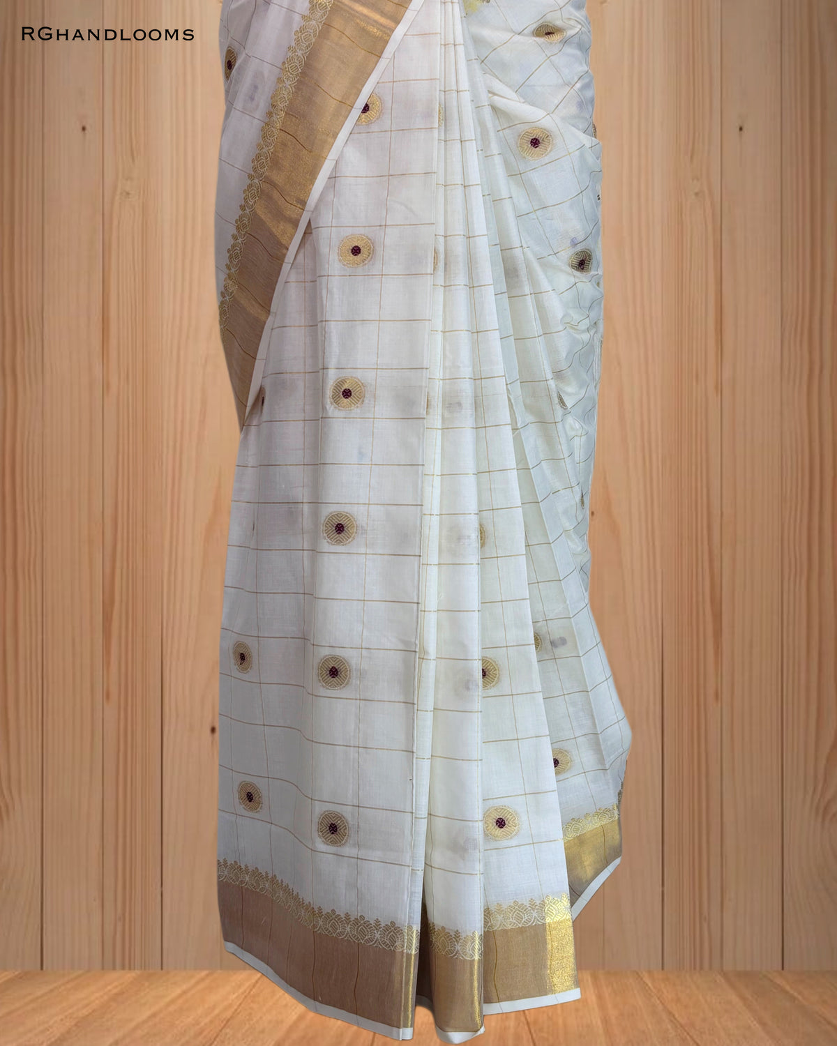 handloom saree featuring a timeless checked design paired with bold red buttas
